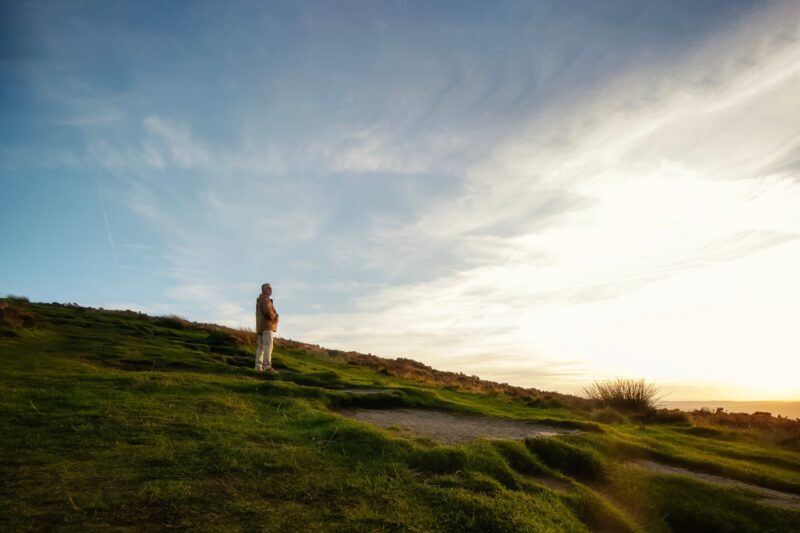 Person looking at a sunset representing SMSF succession and estate planning