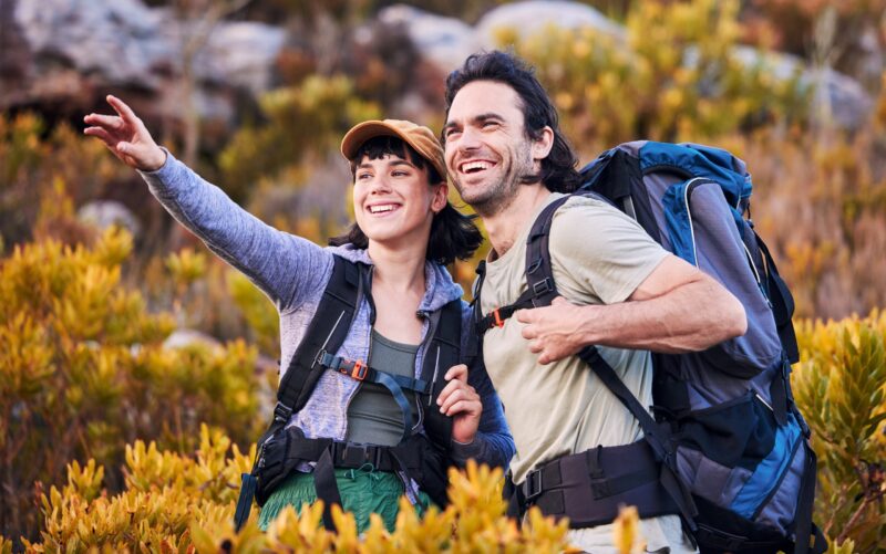 Hiking,,travel,and,couple,pointing,on,mountain,for,adventure,,holiday